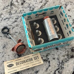 A Mirro Cake Decorator Kit,  model M-0360 from the 1960s.